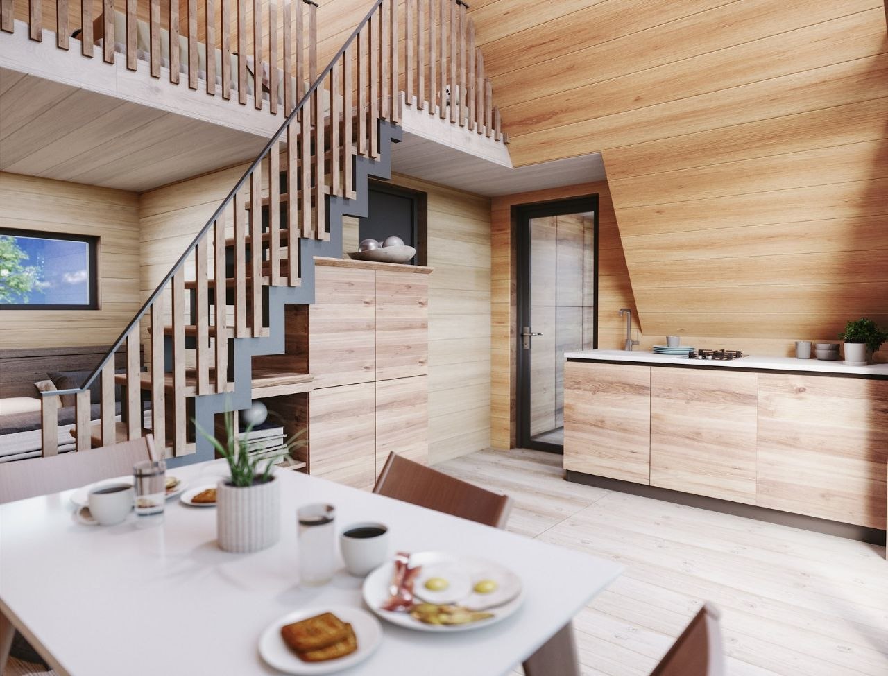Interior mansardă casă A-Frame cu scară